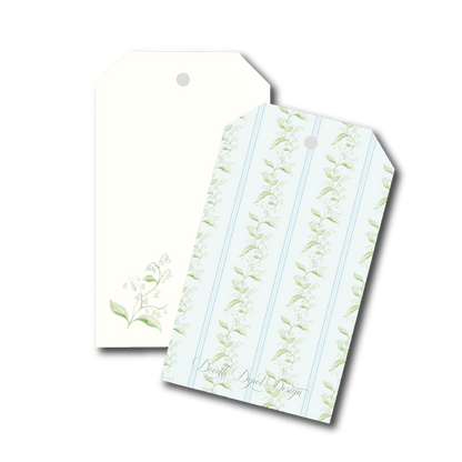 Two decorative gift tags with hanging holes, one plain cream and one with a pale blue and green botanical stripe pattern, shown on a white background.