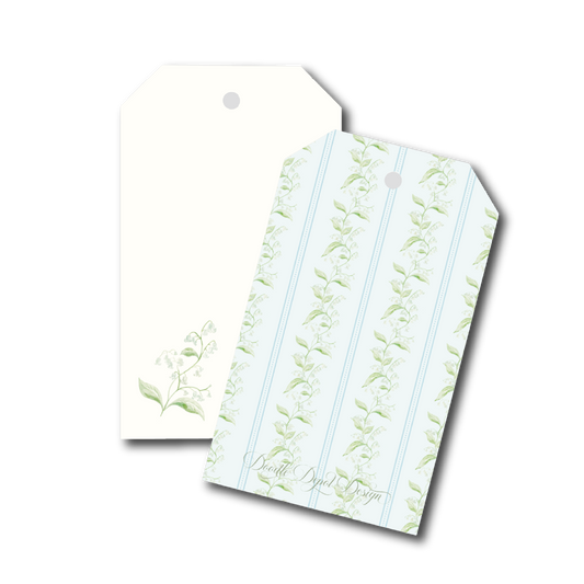 Two decorative gift tags with hanging holes, one plain cream and one with a pale blue and green botanical stripe pattern, shown on a white background.